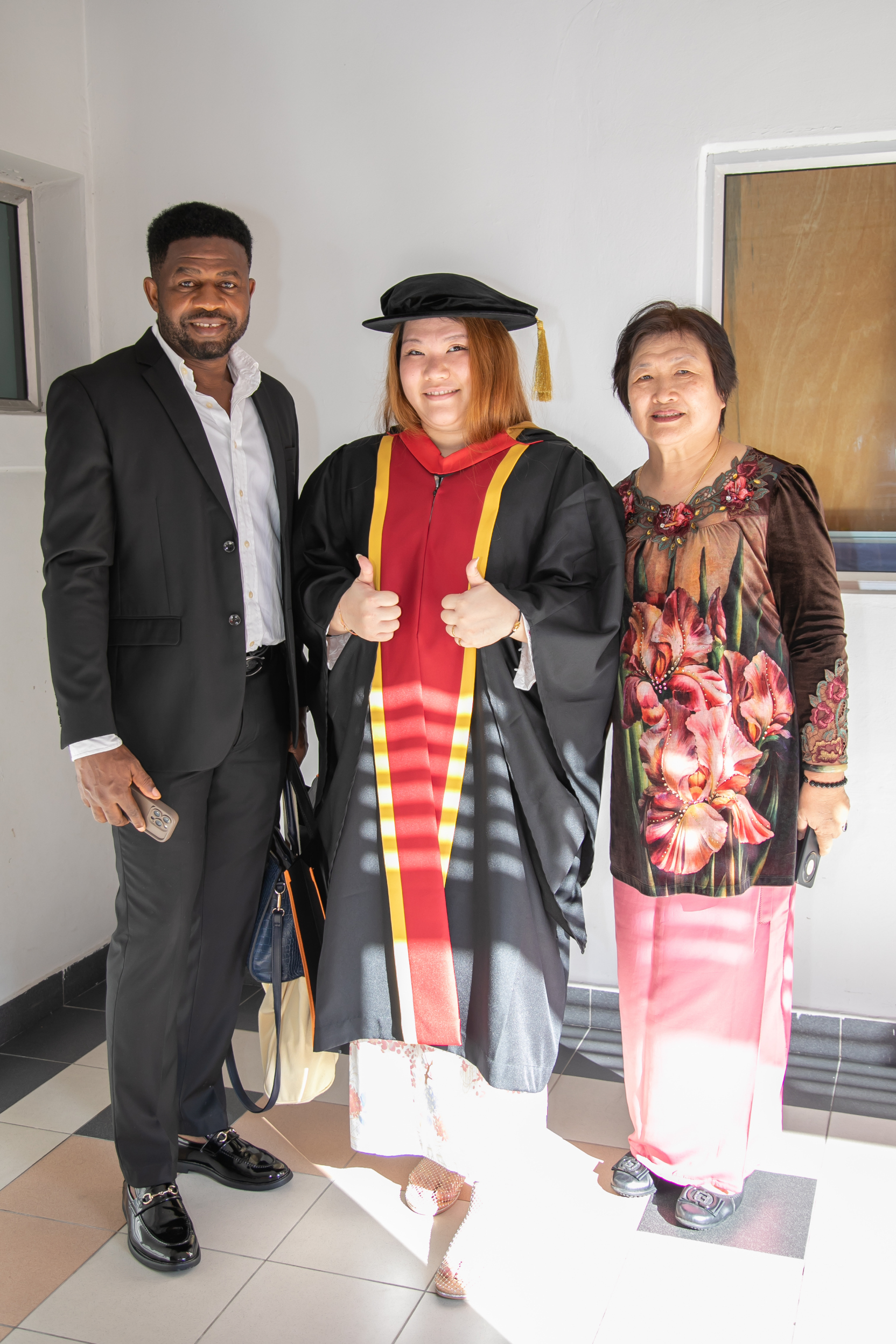 IBSS graduates with Hambra Edu Services at the 2026 convocation