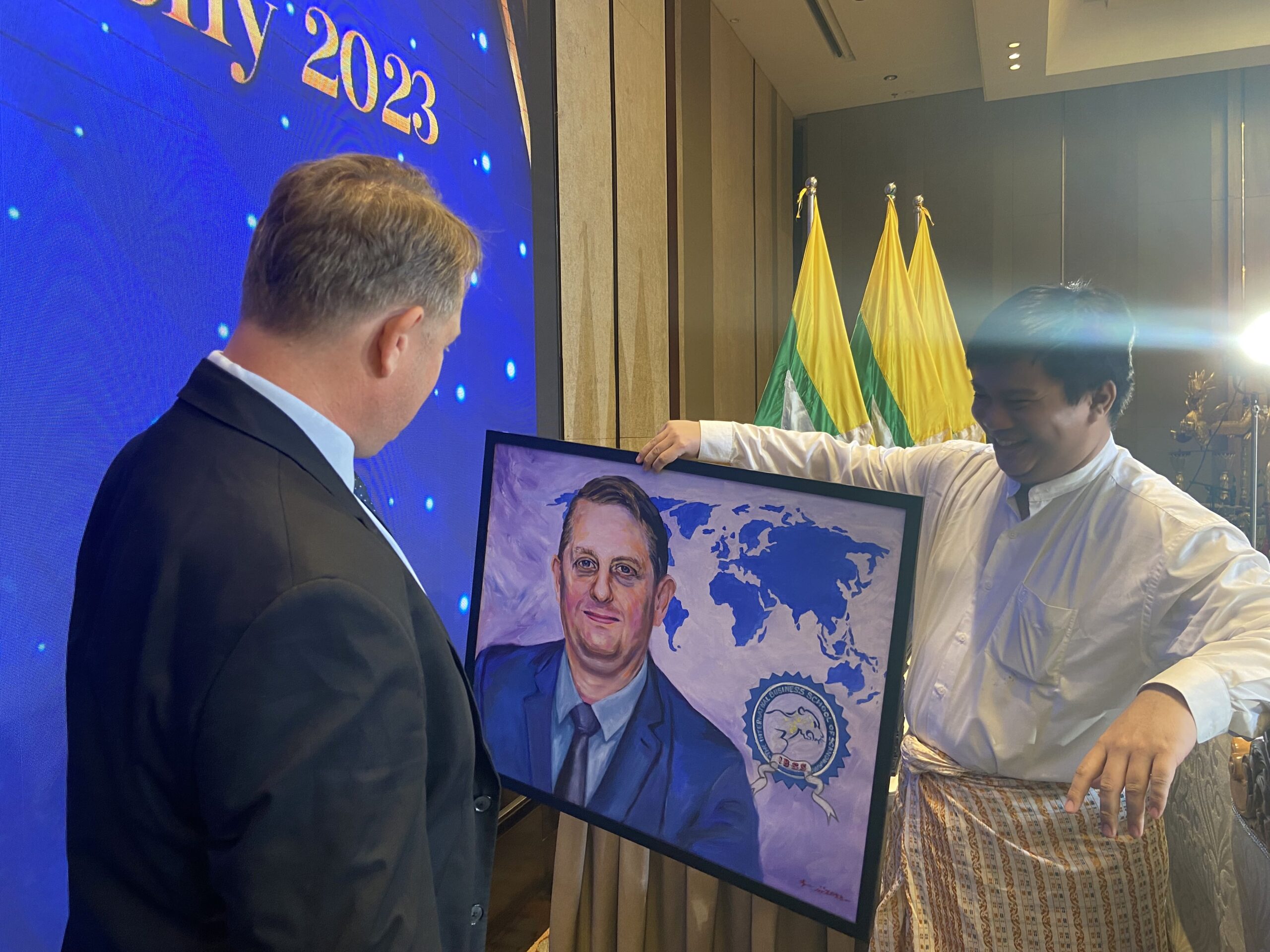 Mr. Martin Nielsen presented with a portrait gift at the MMI Graduation