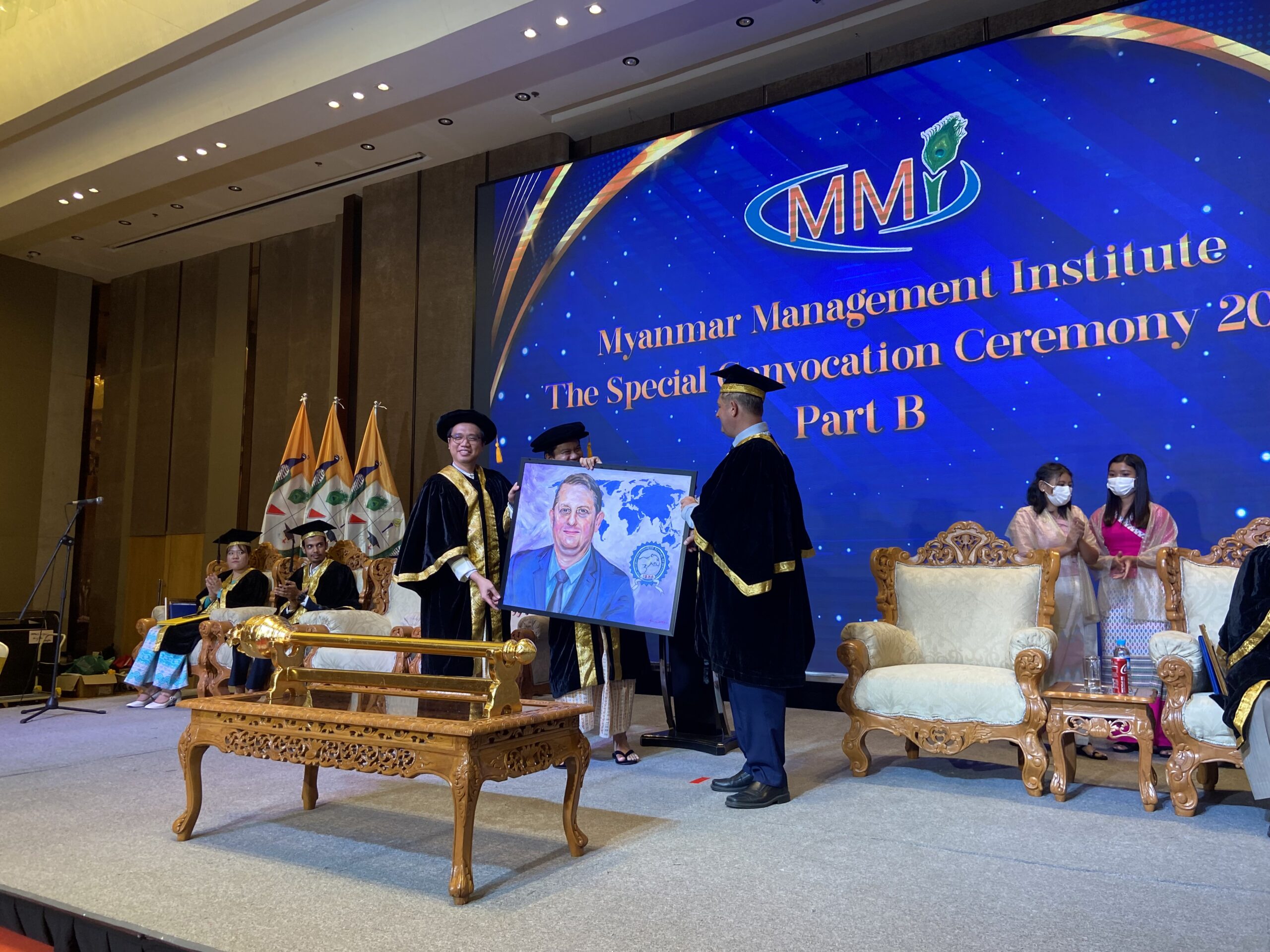 Portrait of Mr. Martin Nielsen presented on stage during the MMI Graduation
